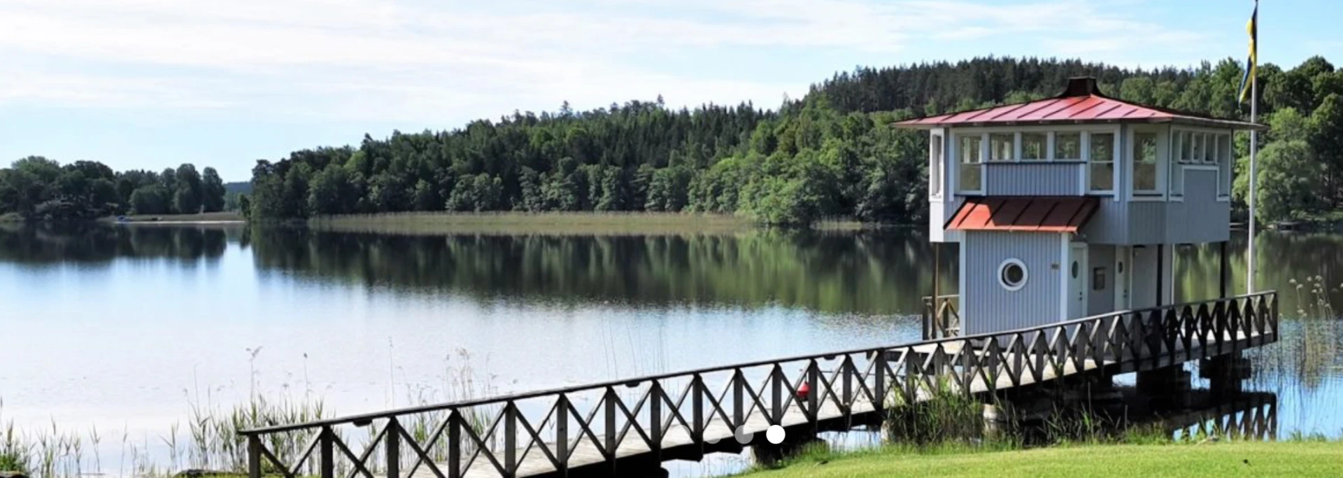 Wooden jetty and pavilion on Lake Mälaren at Campus Kämpasten